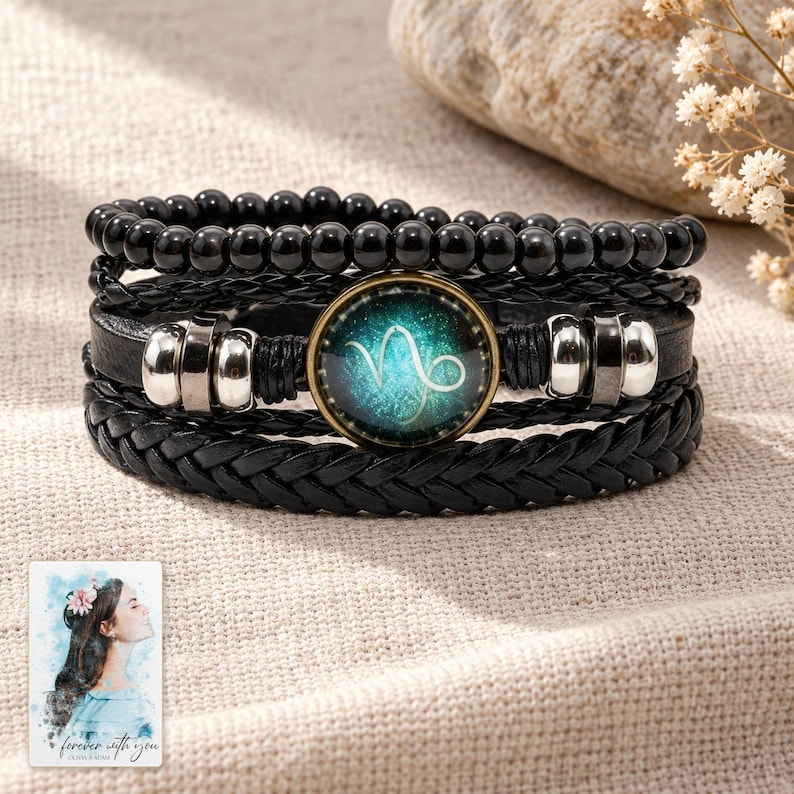 Zodiac Sign Bracelet, laid on fabric. A sample personalized digital greeting card is shown alongside.