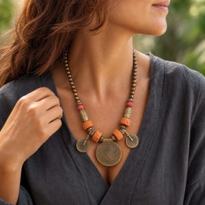 Three-piece handmade necklace set featuring rose gold and gray beaded necklace, beige and rose gold beaded necklace and rose gold and blue beaded necklace, displayed together to show the coordinated colors and beadwork