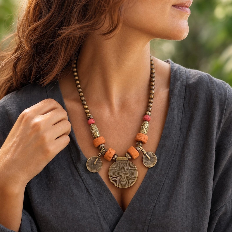 Three-piece handmade necklace set featuring rose gold and gray beaded necklace, beige and rose gold beaded necklace and rose gold and blue beaded necklace, displayed together to show the coordinated colors and beadwork