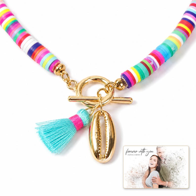 Blue Fiesta Shell Necklace shown during a warm gift-receiving moment between adults with the exact jewelry visible.