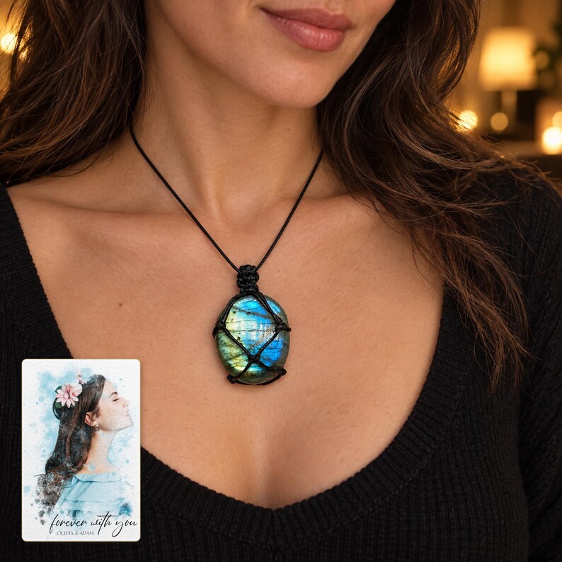 Blue iridescent pendant in a black knotted net worn on a black cord, beside a personalized digital greeting card.
