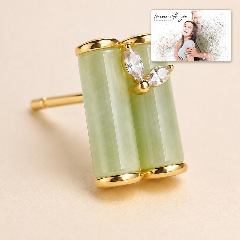Pale green bamboo-shaped stud earrings with gold-tone edges, close detail view. A personalized greeting-card example appears in the corner.