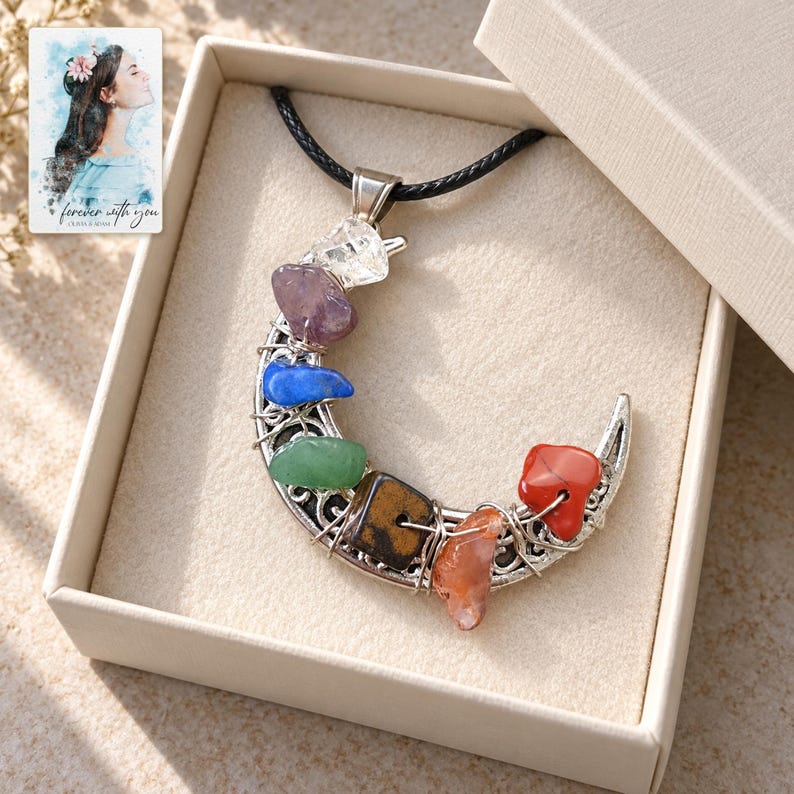 Rainbow Chip Moon Necklace, displayed in a presentation box. A sample personalized digital greeting card is shown alongside.