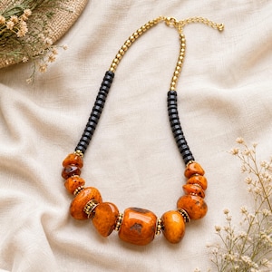 Gift ready presentation of Orange and Brown Statement Beaded Necklace, Boho Handmade Jewelry, Artisan Gift for Her in an open jewelry box lined with natural ivory linen