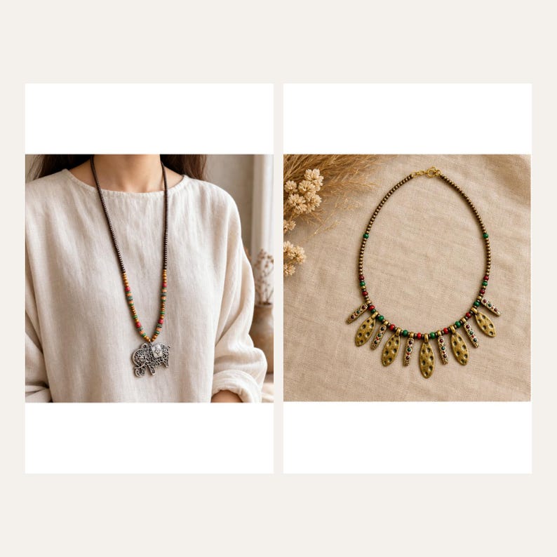 May include: A long necklace featuring small brown, red, and green beads with a large silver-toned elephant pendant, alongside a shorter necklace with gold-toned leaf-shaped charms, small red and green beads, and a metallic chain.