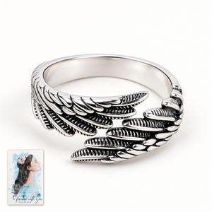 Angel Wings Wrap Ring, shown against a light background. A sample personalized digital greeting card is shown alongside.