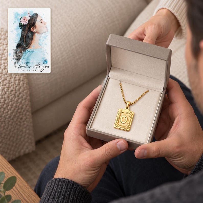 Adult recipient holding an open styling box containing the gold tone O initial necklace. A personalized digital greeting card is shown alongside.
