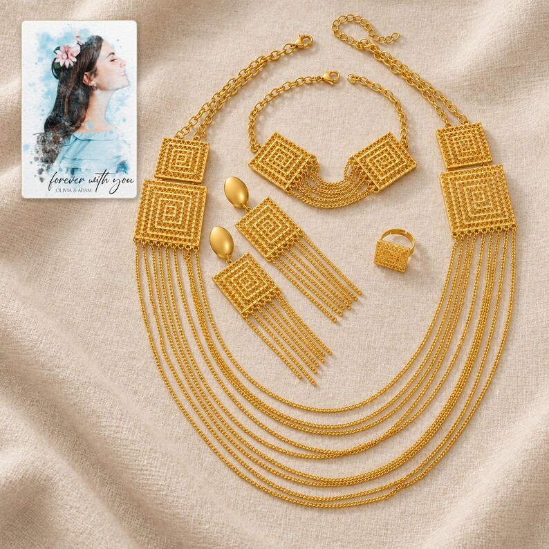 Golden Tassel Jewelry Suite arranged on soft ivory linen in a refined neutral flat lay. A personalized digital greeting card is shown alongside.