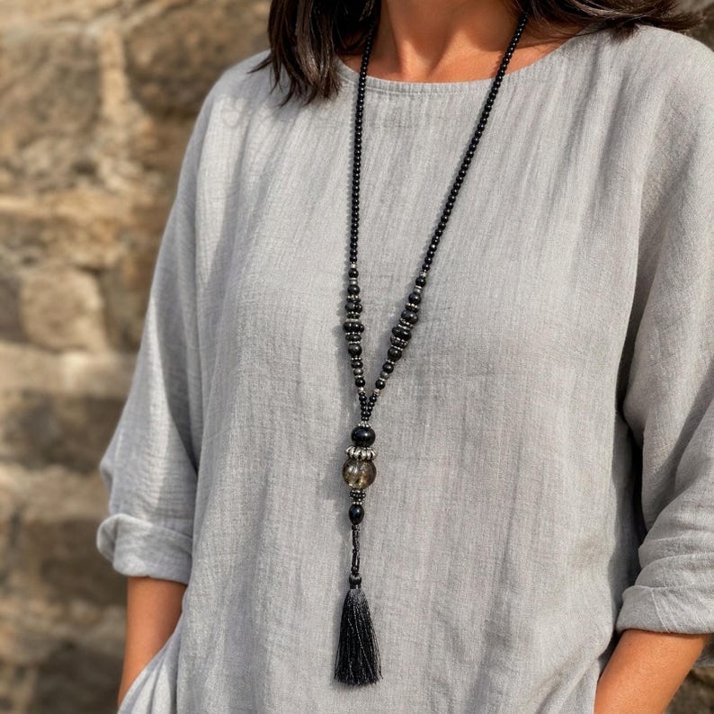 Three-piece handmade necklace set featuring gray and white beaded necklace, gray and silver beaded necklace and rose gold and silver beaded necklace, displayed together to show the coordinated colors and beadwork