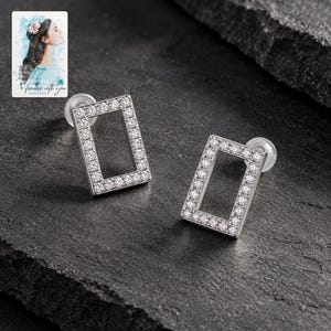 Rectangle Moissanite Stud Earrings, shown against a dark background. A sample personalized digital greeting card is shown alongside.