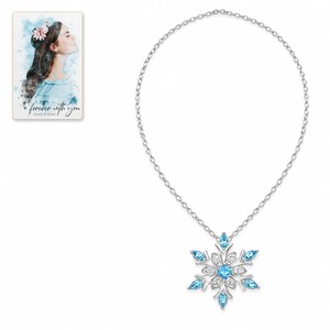 Winter Azure Snowflake Necklace shown on a clean white catalog background for an unobstructed product view. A personalized digital greeting card is shown alongside.