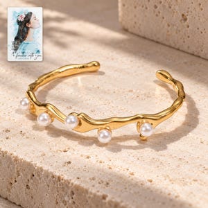 Gold Tone Cuff Bracelet, shown in natural light. A sample personalized digital greeting card is shown alongside.