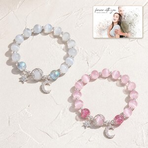 Starlit Moon Bead Bracelet photographed in warm natural window light in an elegant home setting.