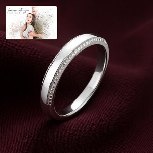 First Sight 925 Promise Rings arranged on soft ivory linen in a refined neutral flat lay.