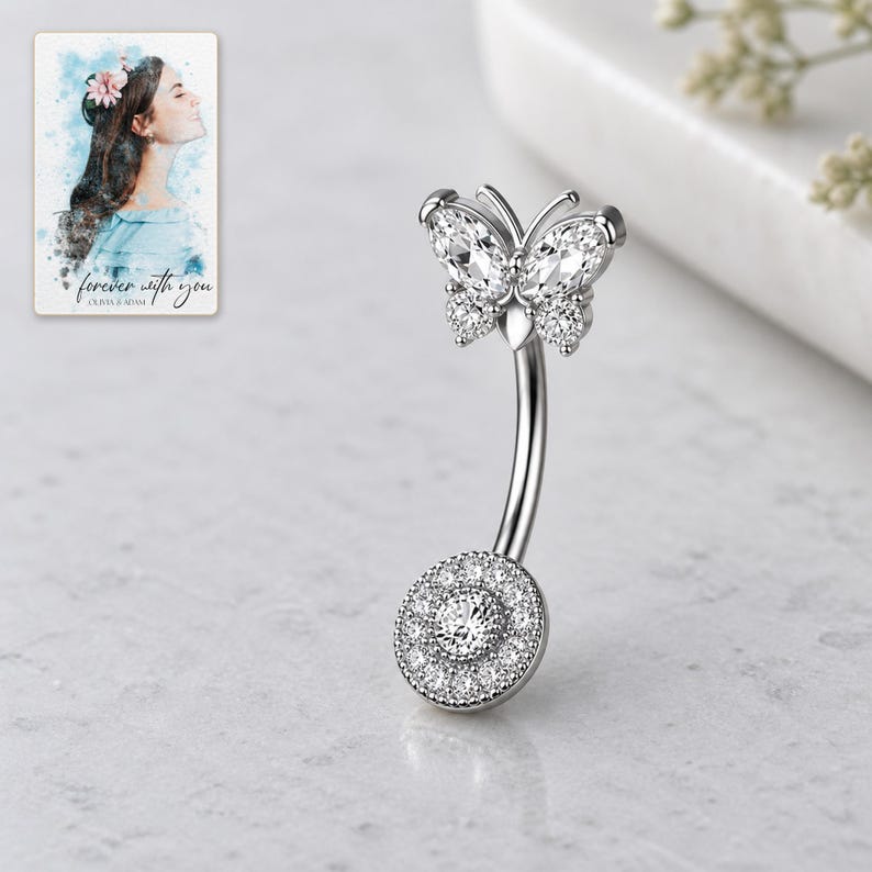 Close view of the four-stone style butterfly, curved silver-tone shaft and round pavé disc. A personalized digital greeting card is shown alongside.