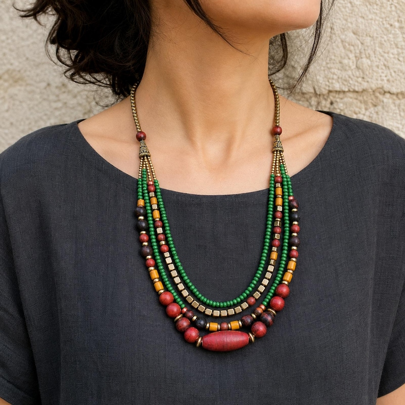 Three-piece handmade necklace set featuring rose gold and silver beaded necklace, gray and silver beaded necklace and beige and brown beaded necklace, displayed together to show the coordinated colors and beadwork