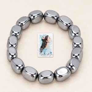Metallic Grey Bead Bracelet, hero view. A personalized digital greeting card is shown alongside.