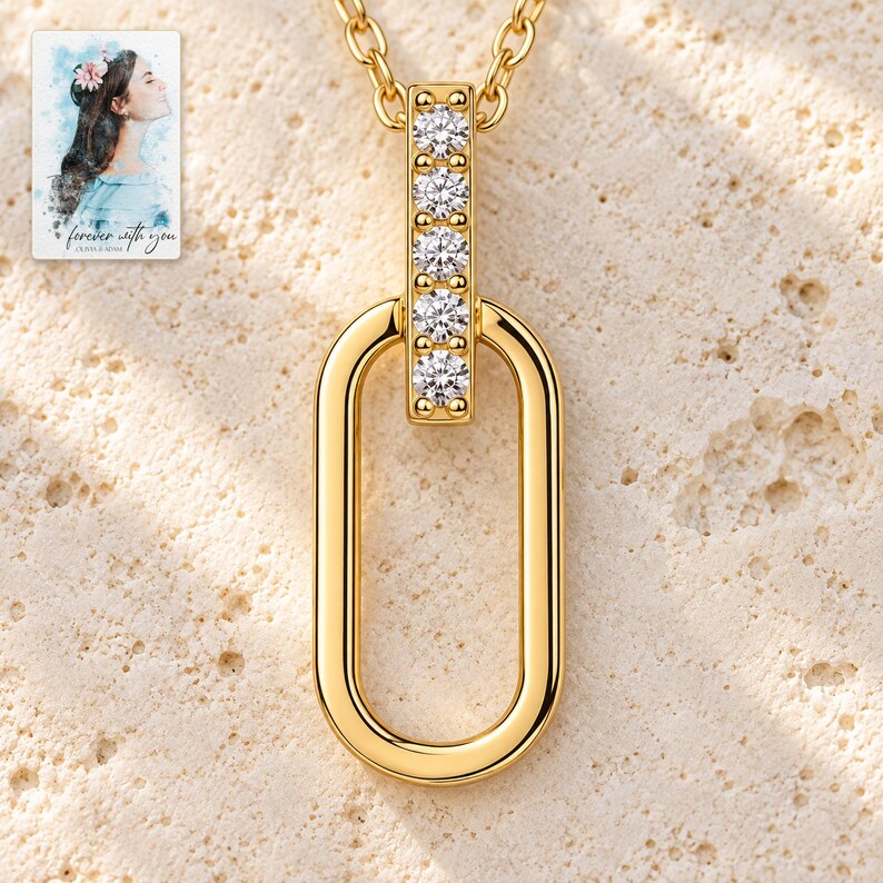 Oval Link Moissanite Necklace, shown on a display surface. A sample personalized digital greeting card is shown alongside.