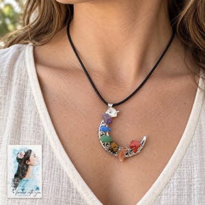 Rainbow Chip Moon Necklace, worn by an adult. A sample personalized digital greeting card is shown alongside.