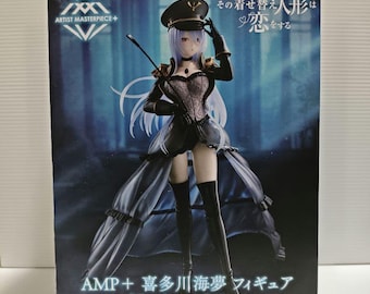 May include: A boxed anime figure of a woman in a black military-style outfit with a hat and a long skirt. The figure has long, light purple hair and is holding a riding crop. The box has Japanese text and the words "Artist Masterpiece+".