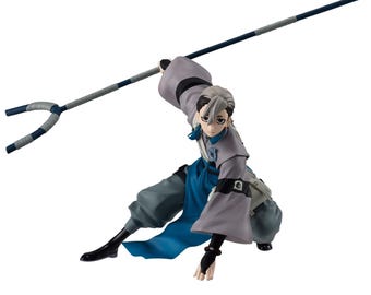 May include: A dynamic anime-style figurine of a character with silver hair, wearing a grey and blue outfit with a sash, crouching while holding a long, two-pronged staff weapon with blue and grey wrappings extended above their head.