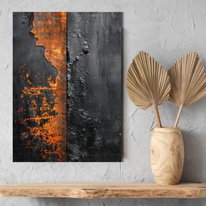 Peut inclure: Impression artistique abstraite avec une surface textur&eacute;e aux tons contrast&eacute;s de noir et d'orange. L'&oelig;uvre est divis&eacute;e en deux sections verticales, avec une texture orange rouille &agrave; gauche et une texture sombre et rugueuse &agrave; droite.