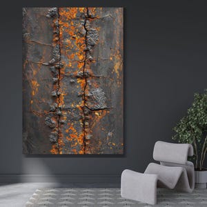 May include: Abstract art print featuring a close-up of a weathered, textured surface. The artwork displays a dark, possibly metallic background with vertical bands of orange and rust-colored oxidation, creating a striking contrast. The piece is mounted on a wall.