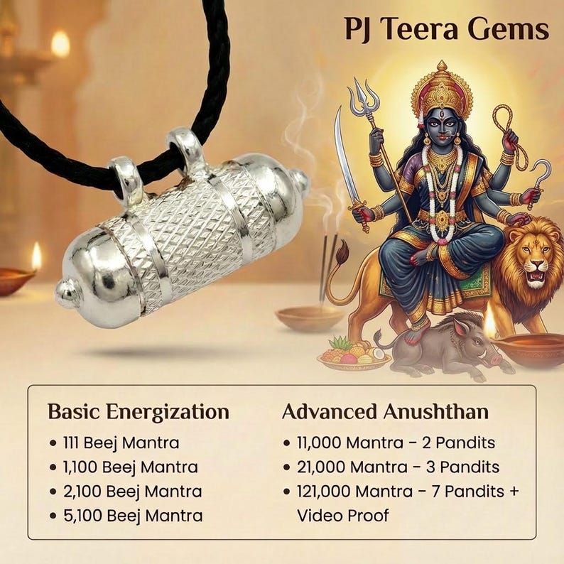 May include: A silver-toned cylindrical pendant with a textured cross-hatch pattern, suspended on a black cord. The image features text reading PJ Teera Gems, Basic Energization, and Advanced Anushthan, alongside an illustration of a deity.