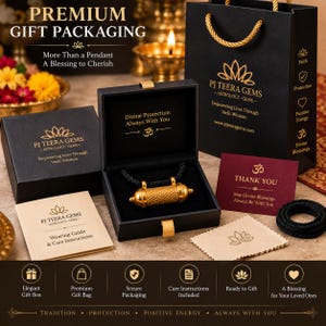 May include: A gold-toned cylindrical pendant with a textured surface rests inside a black box. The set includes a black gift bag, a maroon thank you card, a beige care instruction booklet, and a black cord, all featuring gold-coloured branding.