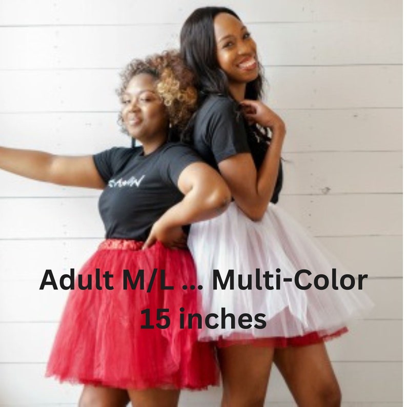 Pu&ograve; includere: Due persone indossano gonne di tulle. La gonna a sinistra &egrave; rossa e la gonna a destra &egrave; bianca. Entrambe le gonne sono lunghe 38 cm. Adulto M/L... Multicolore.