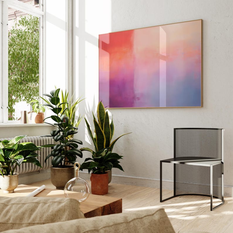 May include: A modern living room with a large abstract painting on the wall, a black metal chair, and several potted plants. The painting features a gradient of pink, orange, and purple colors.