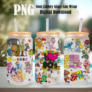May include: Three 16oz Libbey glass can wraps with different designs. The first wrap features characters from Scooby Doo, My Little Pony, and Pac-Man. The second wrap features characters from Garfield, Care Bears, and the 80s. The third wrap features characters from Smurfs, Care Bears, and the 80s.