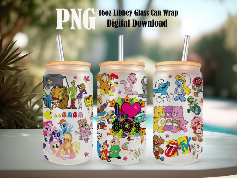May include: Three 16oz Libbey glass can wraps with different designs. The first wrap features characters from Scooby Doo, My Little Pony, and Pac-Man. The second wrap features characters from Garfield, Care Bears, and the 80s. The third wrap features characters from Smurfs, Care Bears, and the 80s.