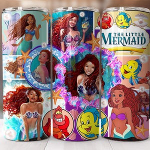May include: A stainless steel tumbler with a colorful design featuring characters from The Little Mermaid. The design includes Ariel, Flounder, Sebastian, and Ursula. The tumbler has a black lid and a straw.