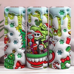 May include: A white tumbler with a festive design featuring characters from The Nightmare Before Christmas and The Grinch. The design includes a Christmas tree, snowflakes, and a red and green cup. The top has a light blue dripping effect.