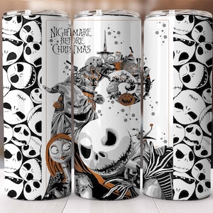 May include: A white tumbler featuring characters and imagery from "The Nightmare Before Christmas." The design includes Jack Skellington, Sally, and other characters in a black, white, and orange color scheme. The tumbler has a repeating pattern of Jack Skellington's face.