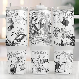 May include: White tumbler with a black and white design featuring characters from the film "The Nightmare Before Christmas". The tumbler has a handle and a lid. The text "Tim Burton's The Nightmare Before Christmas" is printed on the tumbler.