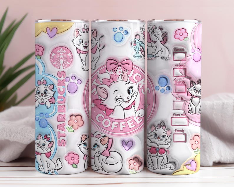 May include: Three white tumblers with a pink and white design featuring the character Marie from the Aristocats. The tumblers have a Starbucks logo and the word "Coffee". The design includes hearts, paw prints, and flowers.