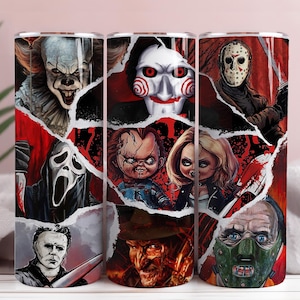 May include: Three stainless steel tumblers with a horror movie character collage. The design features Pennywise, Jigsaw, Chucky, and others, set against a torn red background. The tumblers are cylindrical and suitable for cold drinks.