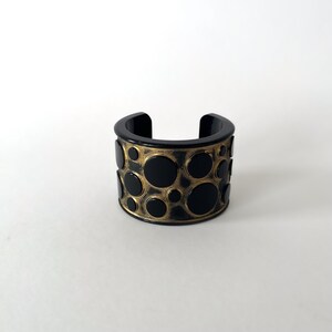Vintage Jean-Marie Poinot cuff bracelet in black and gold acrylic – Art Deco modern design