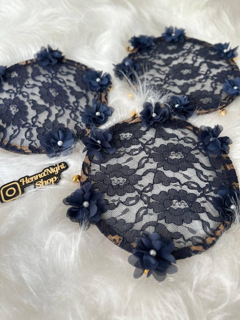 There are blue bridesmaid tambourines. frame made by laser cut flowers and some satin tails