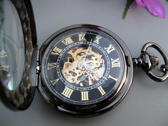 black and gold pocket watch