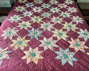 Vintage Dahlia Star Quilt with a Plum Background - 67 x 79 inches