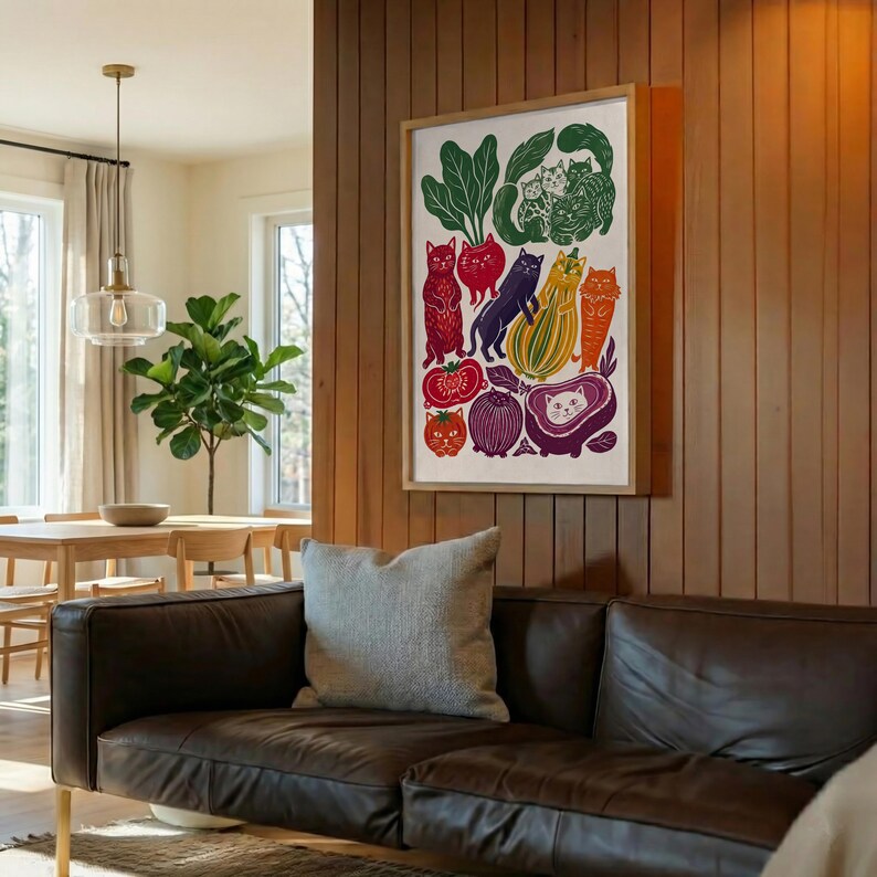 May include: A rectangular wall art print featuring a colorful illustration of various cats integrated with vegetables and fruits, including a red cat, a purple cat, a yellow striped squash cat, and a cat face inside a purple sliced fruit.