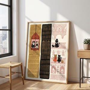 May include: A framed vertical art print featuring three distinct architectural columns. The left column is mustard yellow, the center is black, and the right is light pink. Each section displays stylized cats in various outfits on balconies.