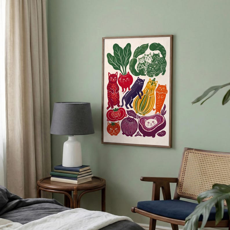 May include: A rectangular wall art print featuring a colorful illustration of various cats integrated with vegetables and fruits. The artwork displays cats in shades of red, purple, orange, and green, arranged alongside depictions of leafy greens, tomatoes, and squash.