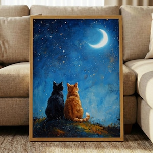 May include: A rectangular framed wall art print featuring a painting of a black cat and an orange cat sitting side by side, looking up at a bright crescent moon and a starry night sky filled with shades of deep blue and textured brushstrokes.