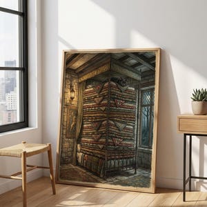 May include: A framed wall art print depicting a tall, precarious stack of colorful patterned quilts piled high on a bed frame within a stone room, with a small black cat resting at the very top of the mattress stack under a canopy.
