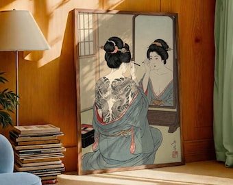 May include: Framed artwork depicting a woman in a kimono applying makeup in a mirror. The woman has a large dragon tattoo on her back. The artwork is in a traditional Japanese style, with soft colors and delicate lines.