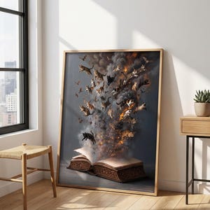 May include: A framed wall art print featuring an open book with a plume of dark smoke and fire rising from its pages. Numerous cats of various colors and patterns are depicted emerging from the smoke, appearing to float upward in a swirling motion.